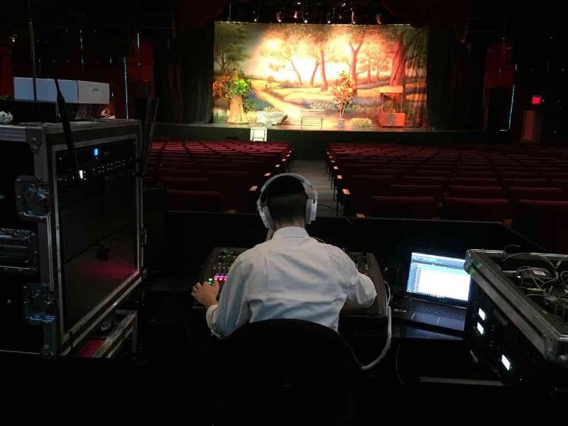 Event Audio Visual Services Thumbnail - Picturing An AV Technician Working His Magic on a Gorgeous Stage