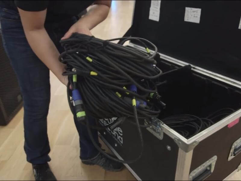 Event Power & Electrical Services Thumbnail - Picturing One of Our Event Electricians Unloading Power Cables